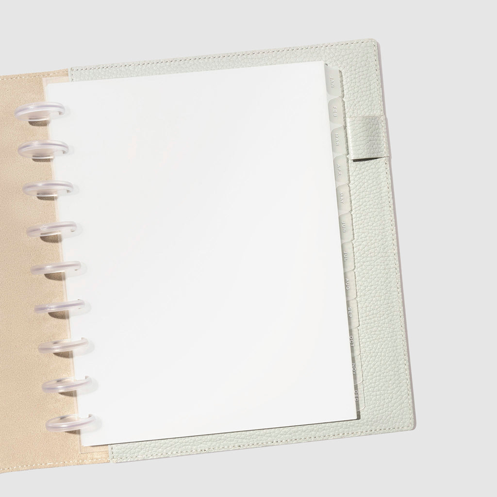 White foil tabs displayed in use inside a leather folio.