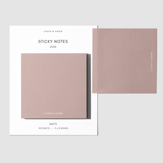 Sticky note set displayed against a white background. One note is placed on the packaging's edge. Color shown is Dusk.