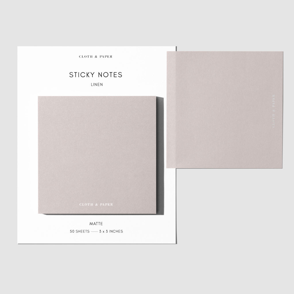 Sticky note set displayed against a white background. One note is placed on the packaging's edge. Color shown is Linen.