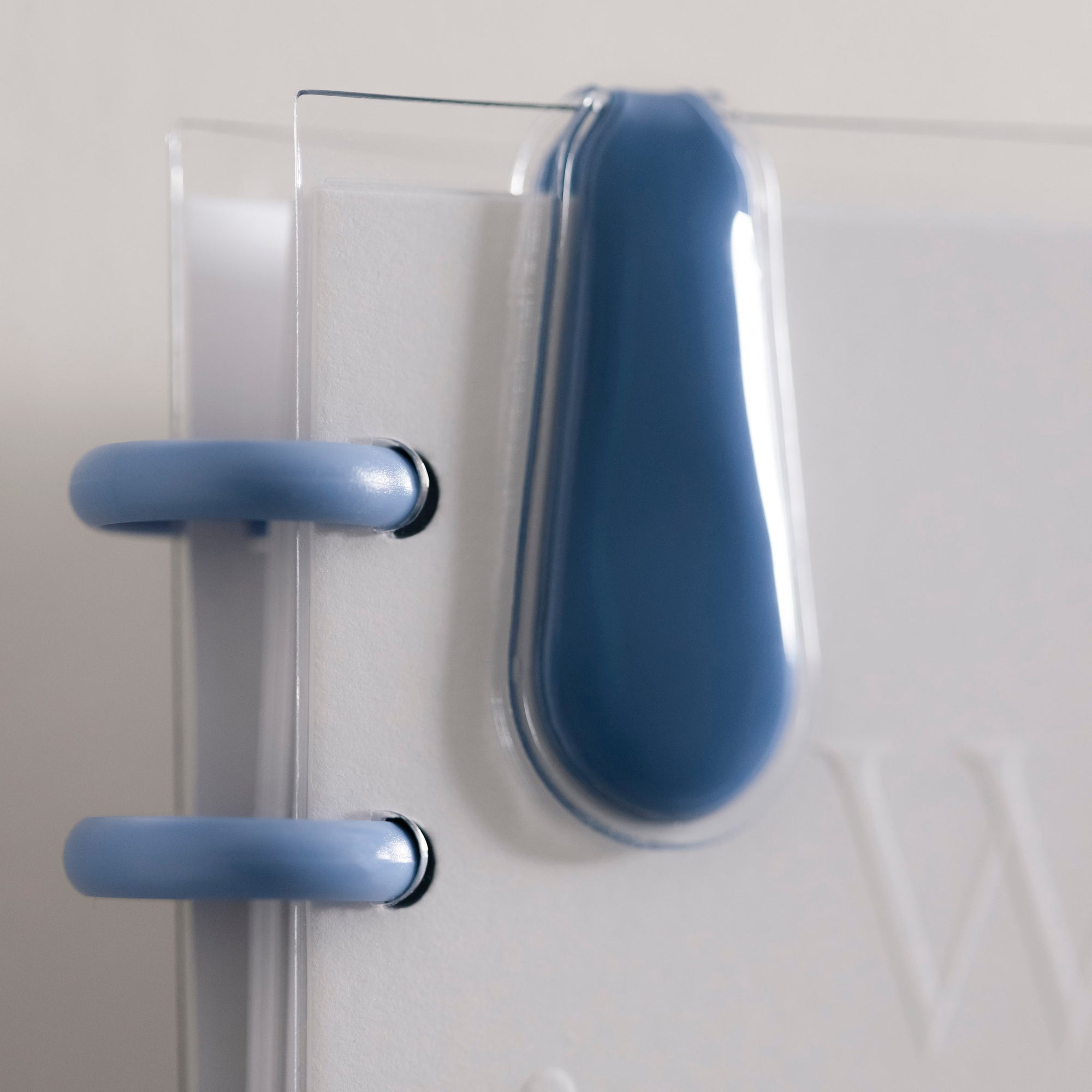 One of the magnetic clips included with the Cloth and PaperClip Duo in Santorini is attached to the edge of the Candid Wellness Journal.