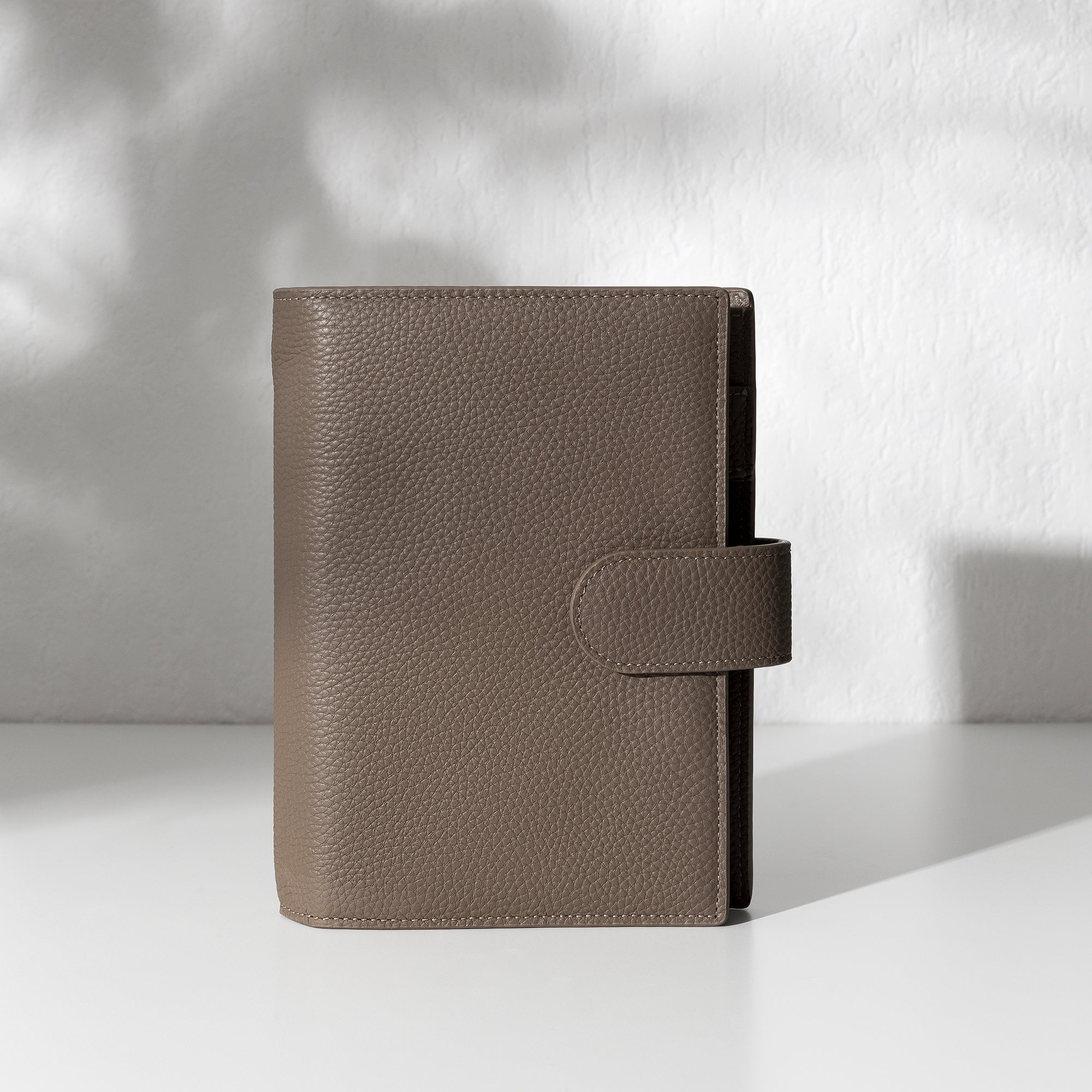 Cortado leather agenda displayed on an off-white background.