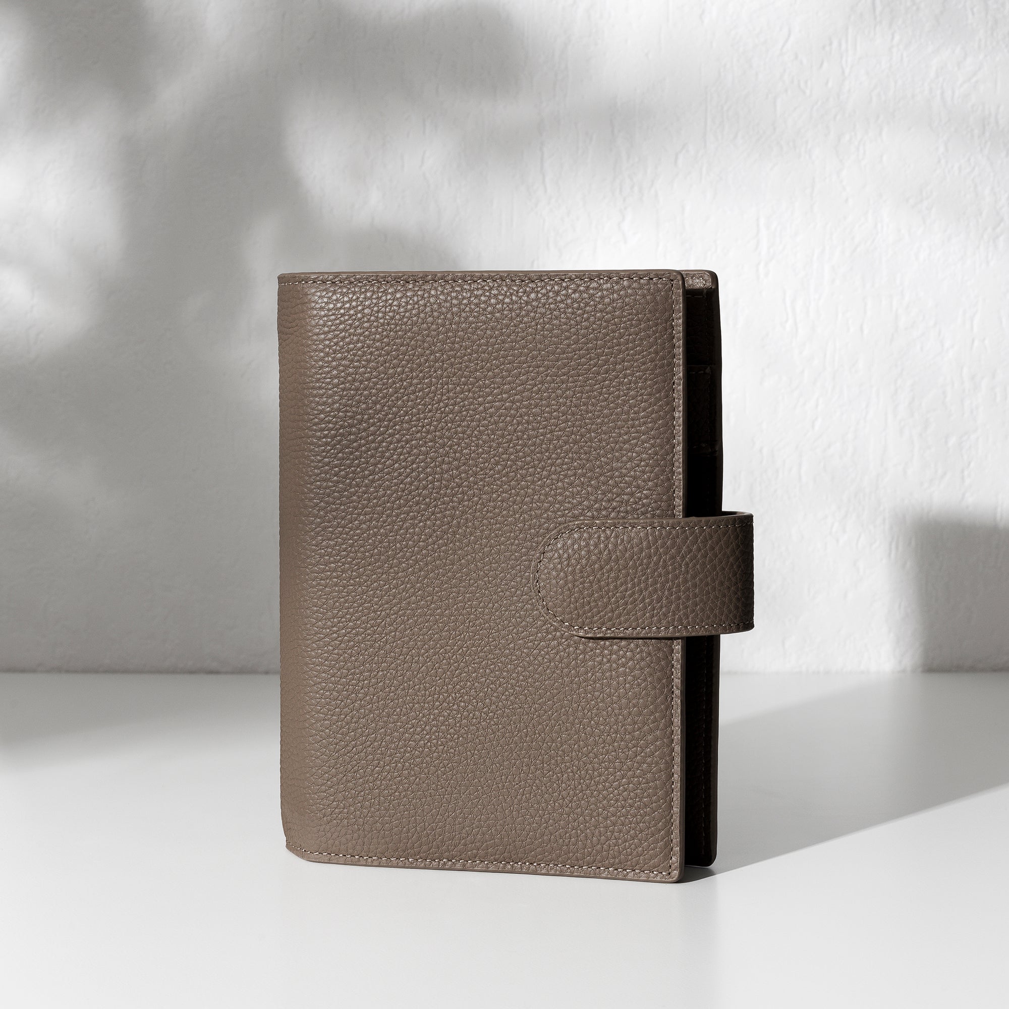 Cortado leather agenda displayed on an off-white background.