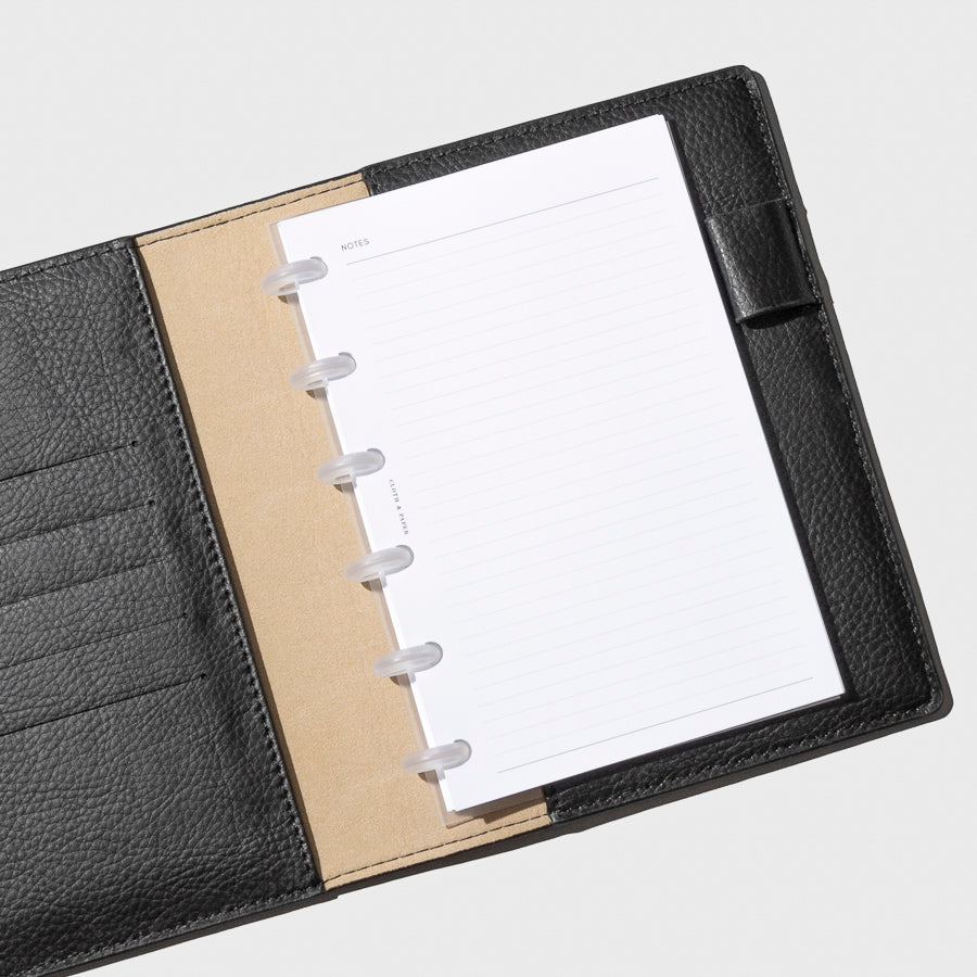 Discs in use inside a black leather agenda.