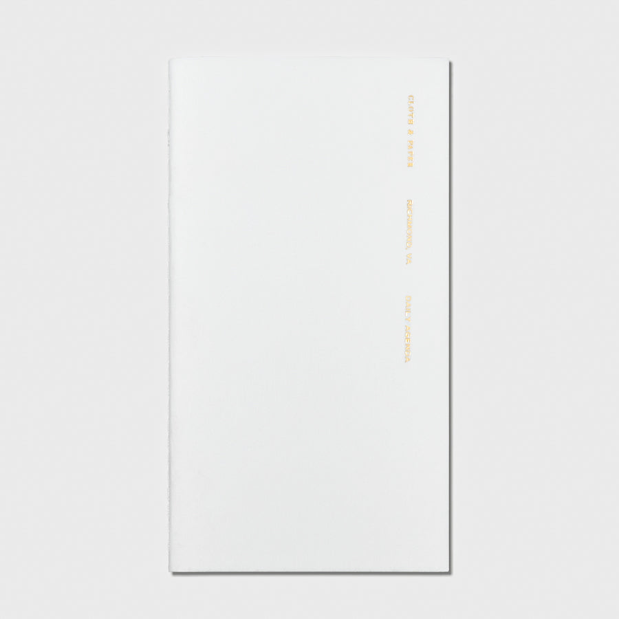 Overview image of the Aspen Daily Agenda Pocket Plus notebook from the Traveler's Notebook Collection. The cover has gold foil text that reads Cloth and Paper Richmond, VA Daily Agenda and is displayed on a light gray background