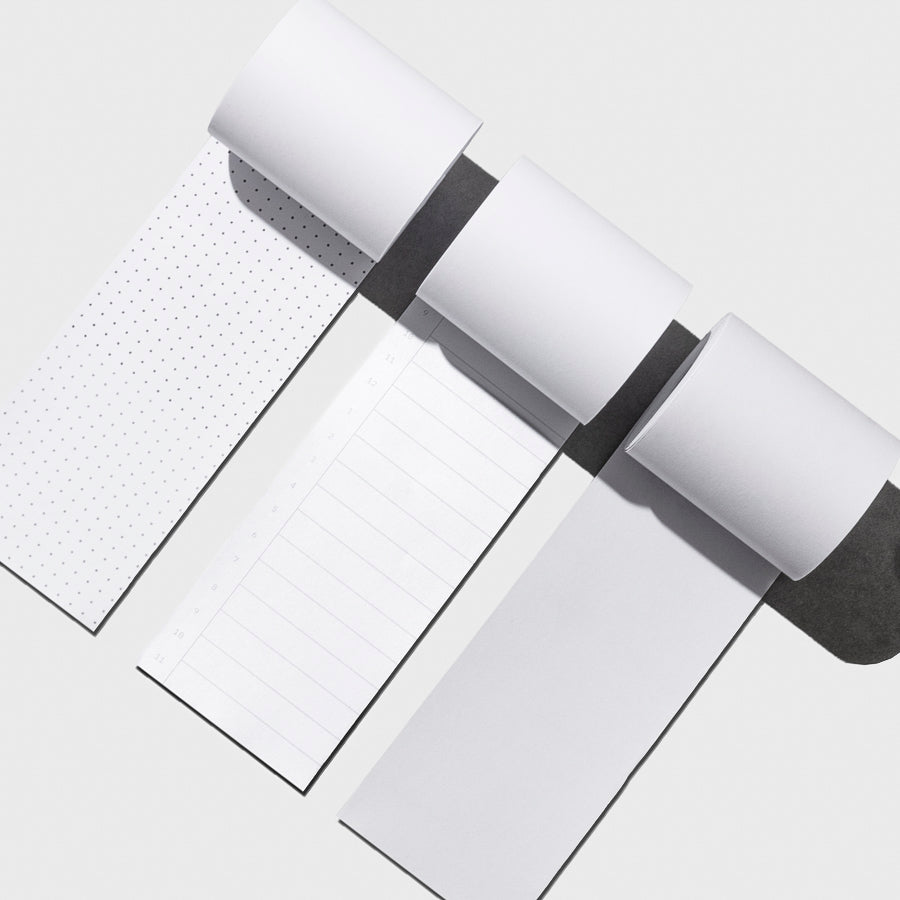 From left to right, the image shows the designs for the dot grid task roll, the time block task roll, and the blank task roll.