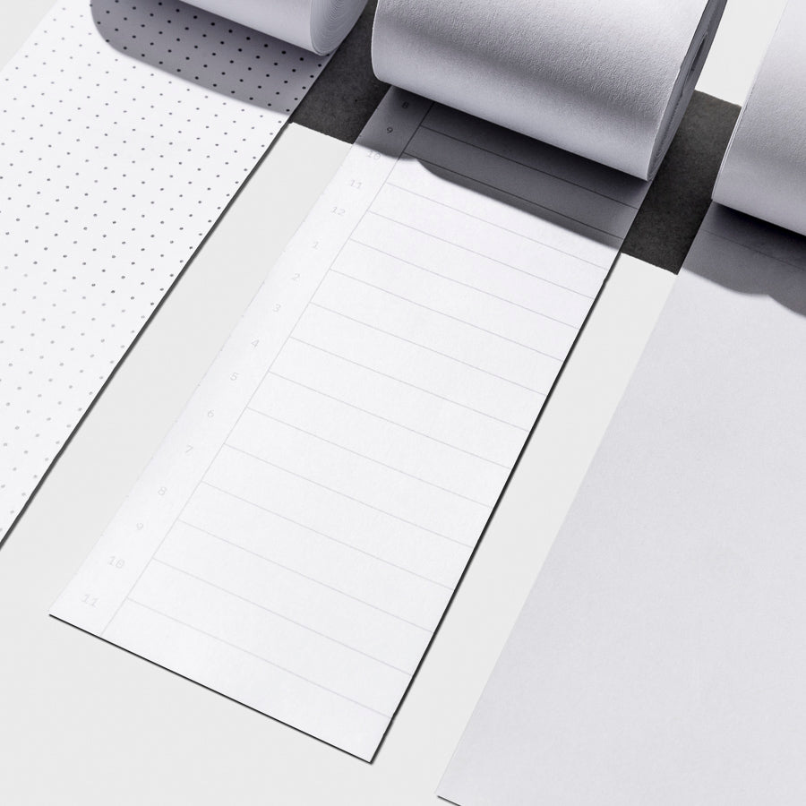 From left to right, the image shows a close-up of the dot grid task roll, the time block task roll, and the blank task roll.