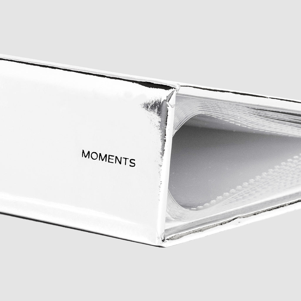 Closeup of the book's spine. Text reads "Moments"