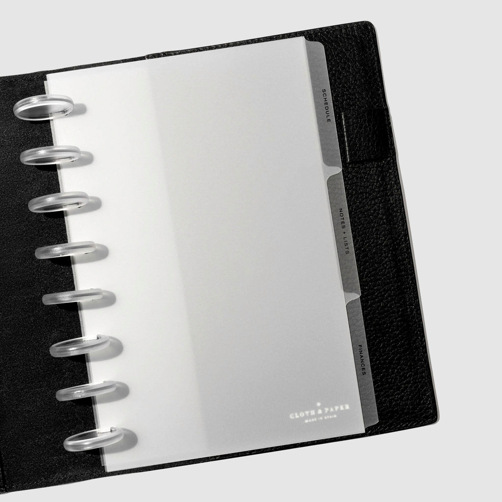 Black foil tabs displayed in use inside a  leather folio.