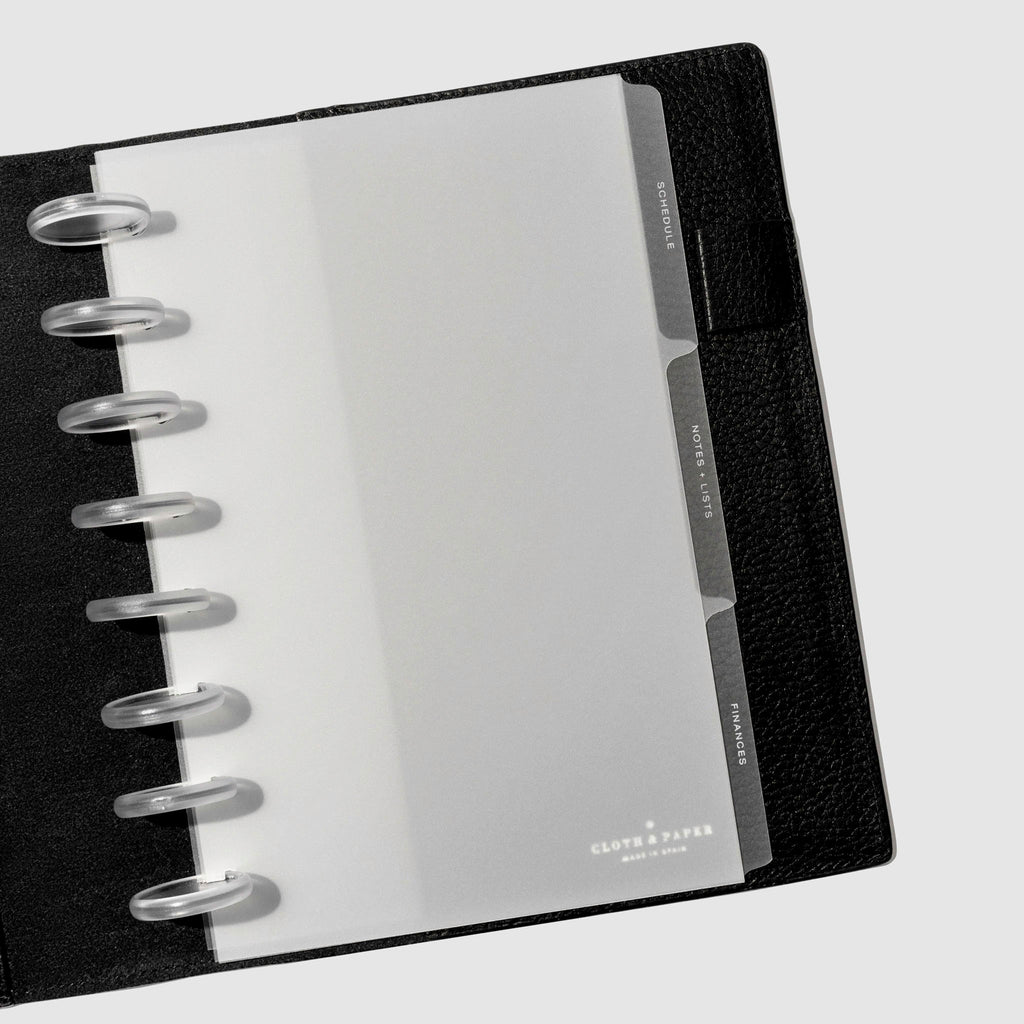 White foil tabs displayed in use inside a  leather folio.