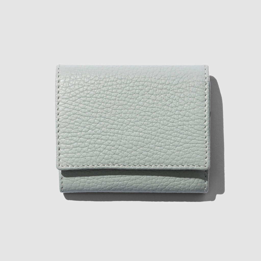 Leather wallet displayed on a neutral background.