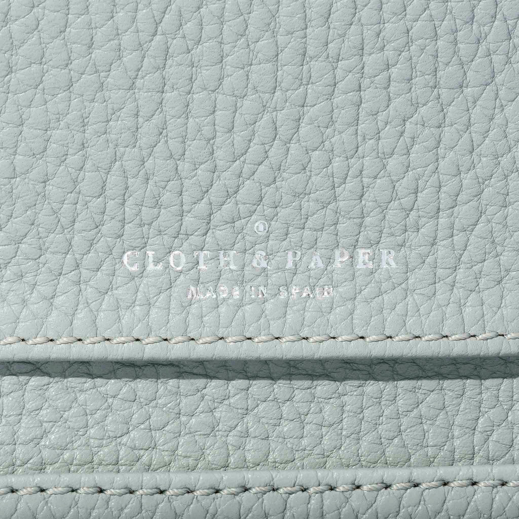 Closeup of embossing on leather wallet.