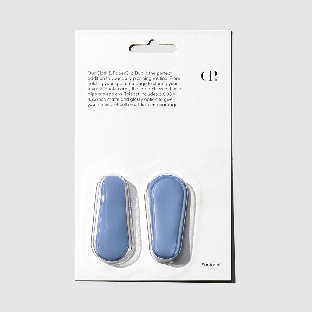 Santorini blue Cloth and Paperclips shown in their packaging on a neutral background.