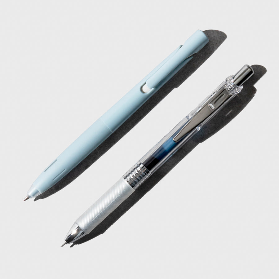 Two pens shown on a neutral background.