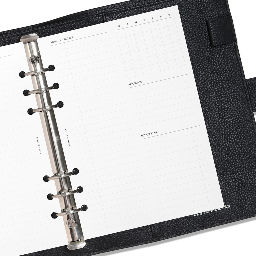 A5 insert in use inside a black leather planner.