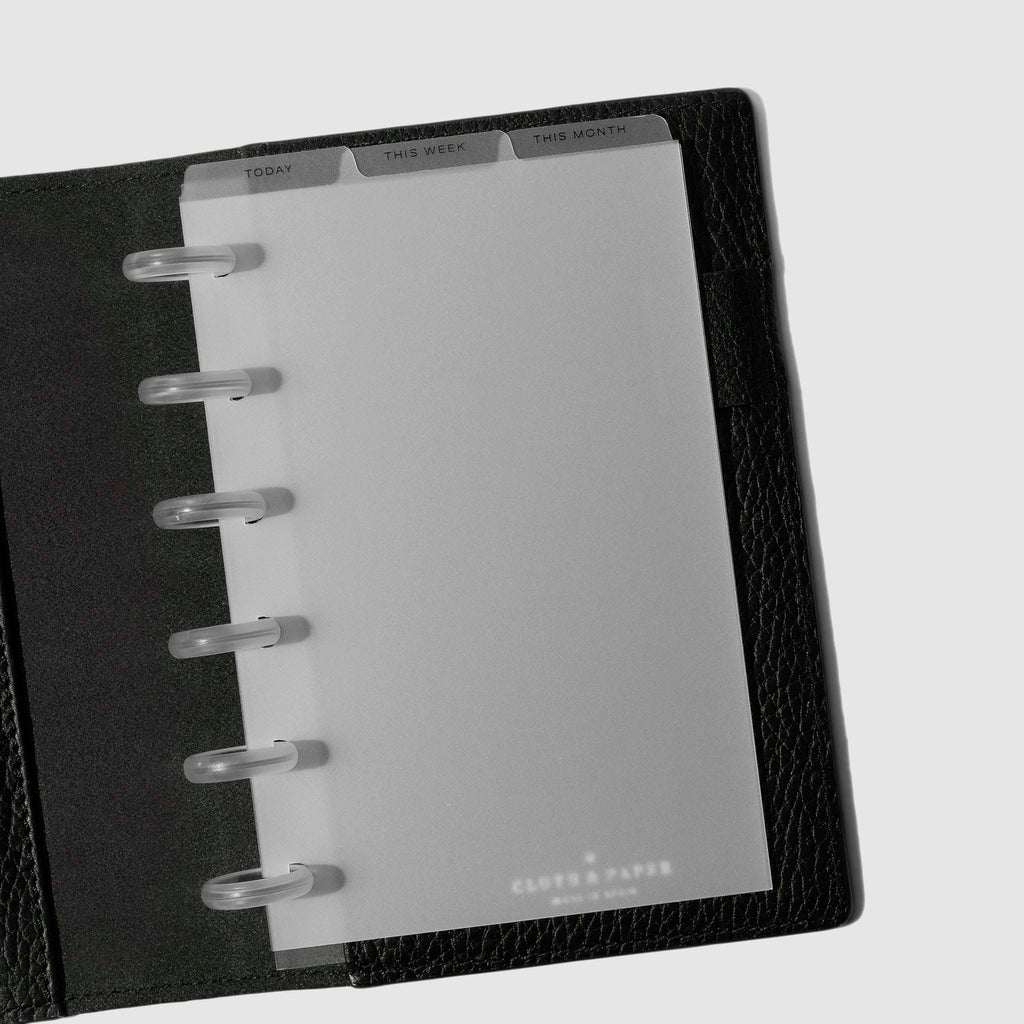 CP Petite Black Foil Cadence Tab Dividers displayed in a black leather planner.