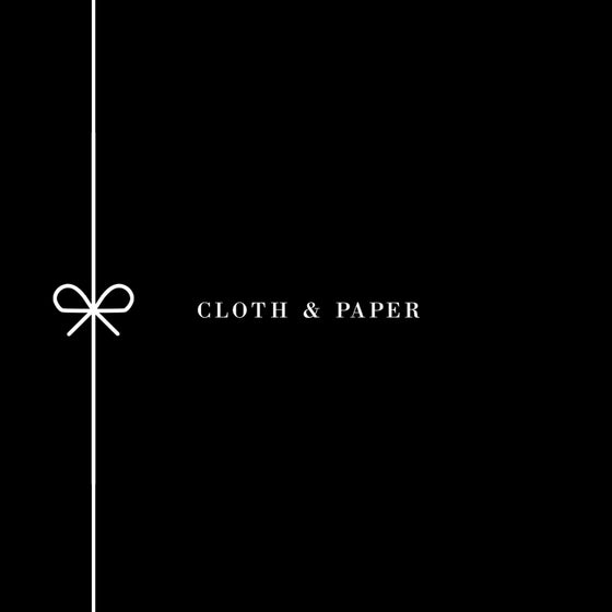 Cloth and Paper Gift Card. Cloth and Paper logo displayed in white text on a black background. There is a vertical bow design to the left.