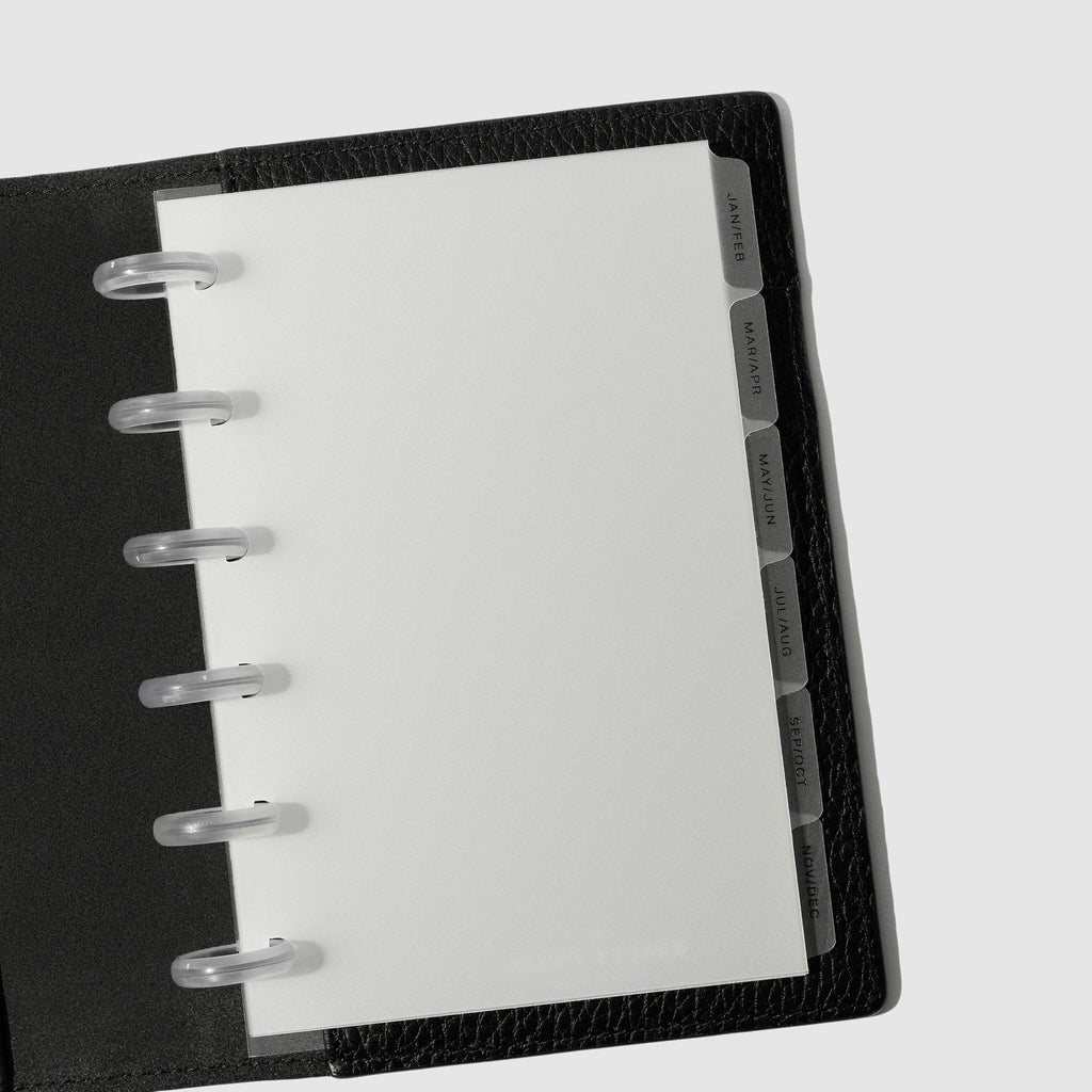 Black foil tabs displayed in use inside a black leather folio.