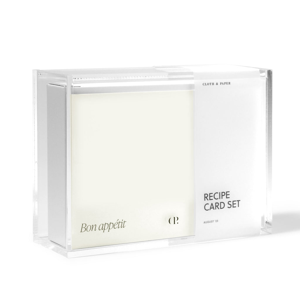 Recipe box in packaging displayed with cards and dividers inside it on a white background.