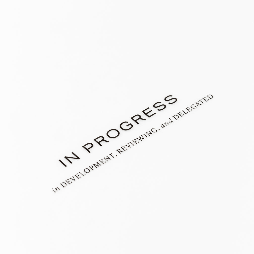 Closeup of text reading "in progress | in development, reviewing, and delegated"