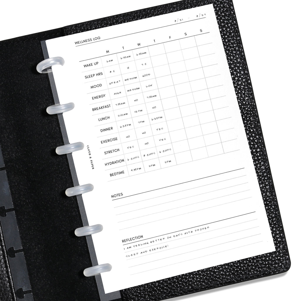 CP Petite Wellness Log insert displayed in a black leather planner. Demo page is shown. 