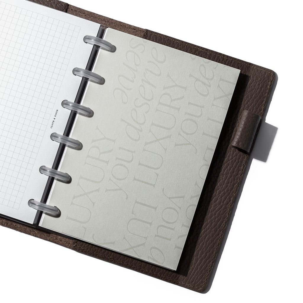 CP Petite dashboard displayed in a brown agenda cover.