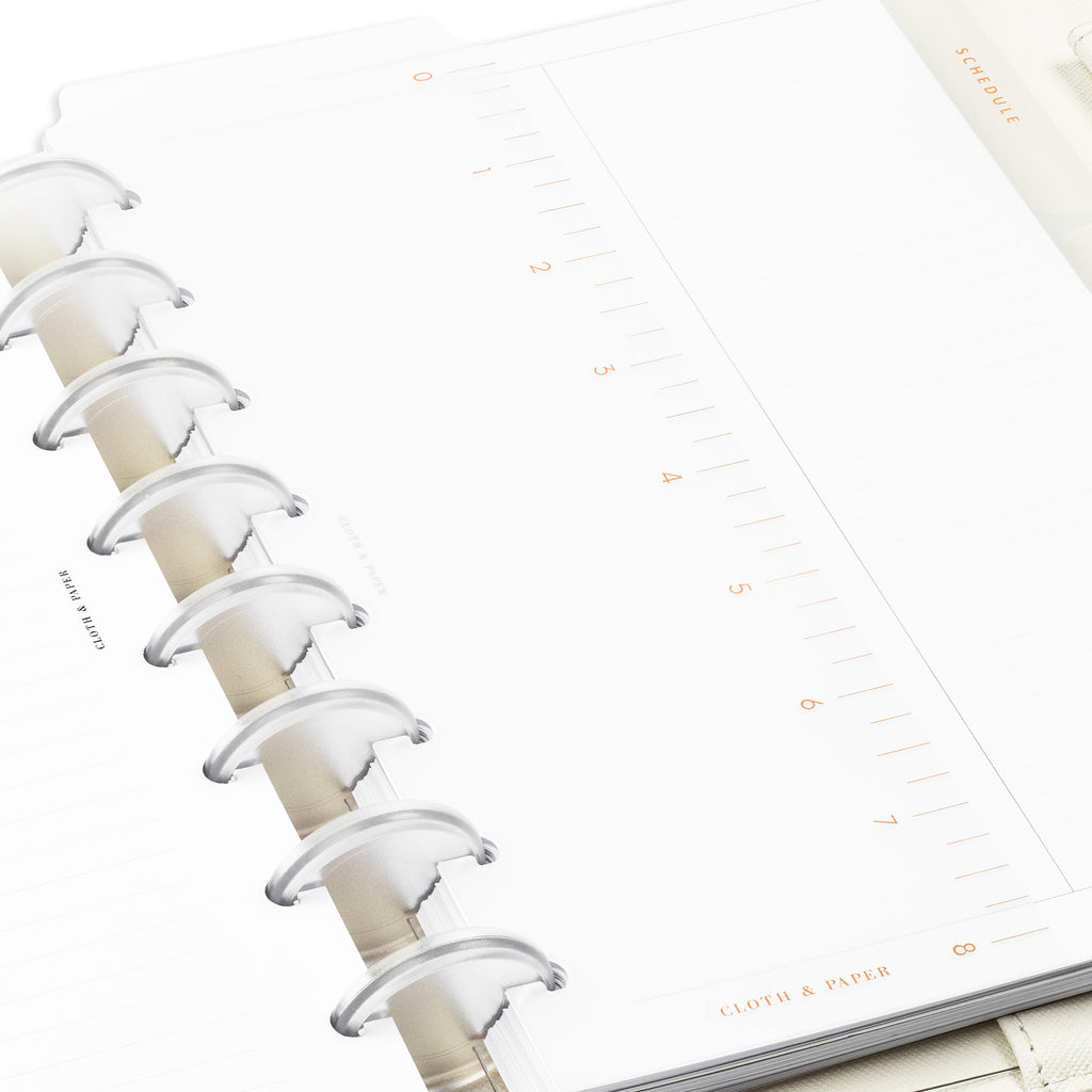 Close up of page marker in use inside a discbound planner system.