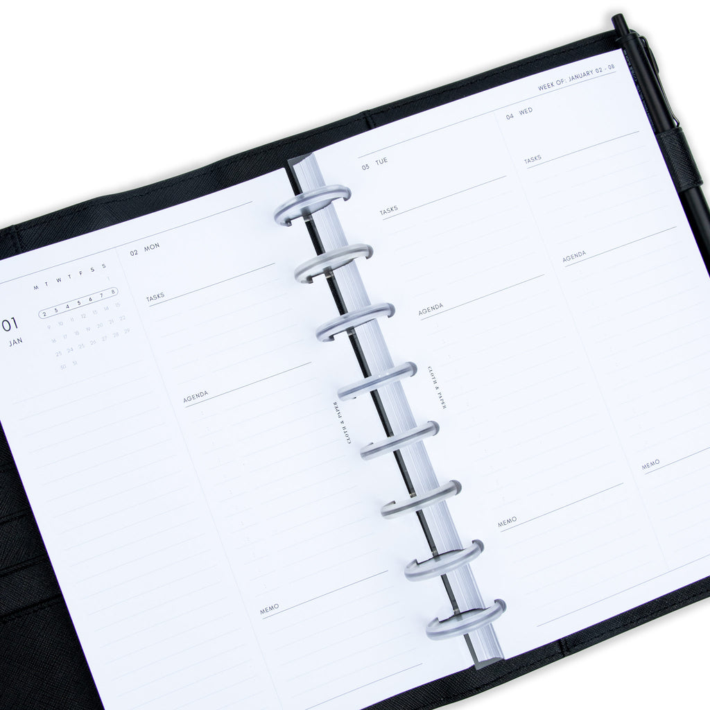 2023 Dated Planner Inserts, Daily, 2 Days Per Page, Cloth and Paper. Inserts in use inside of a black leather agenda cover with clear discs.