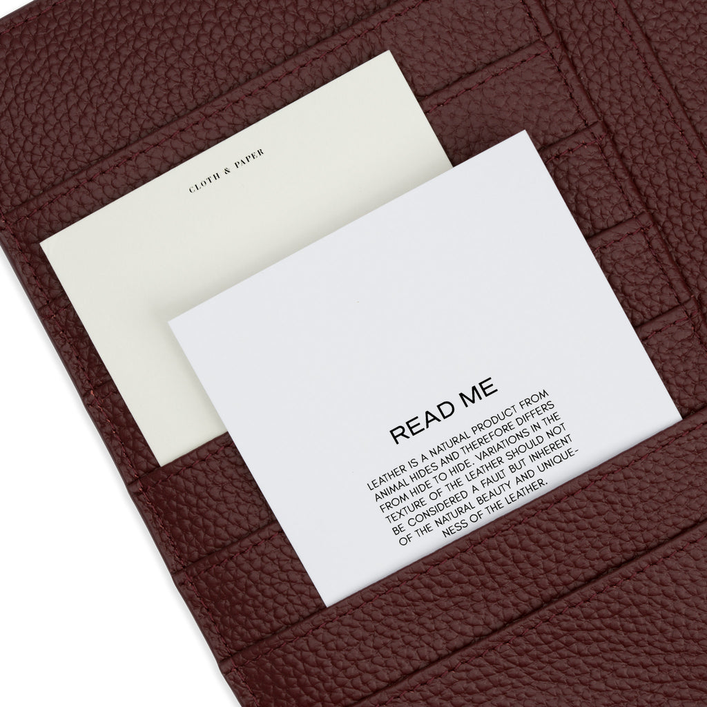 Leather care card and a journaling card in a wine agenda's credit card pocket.