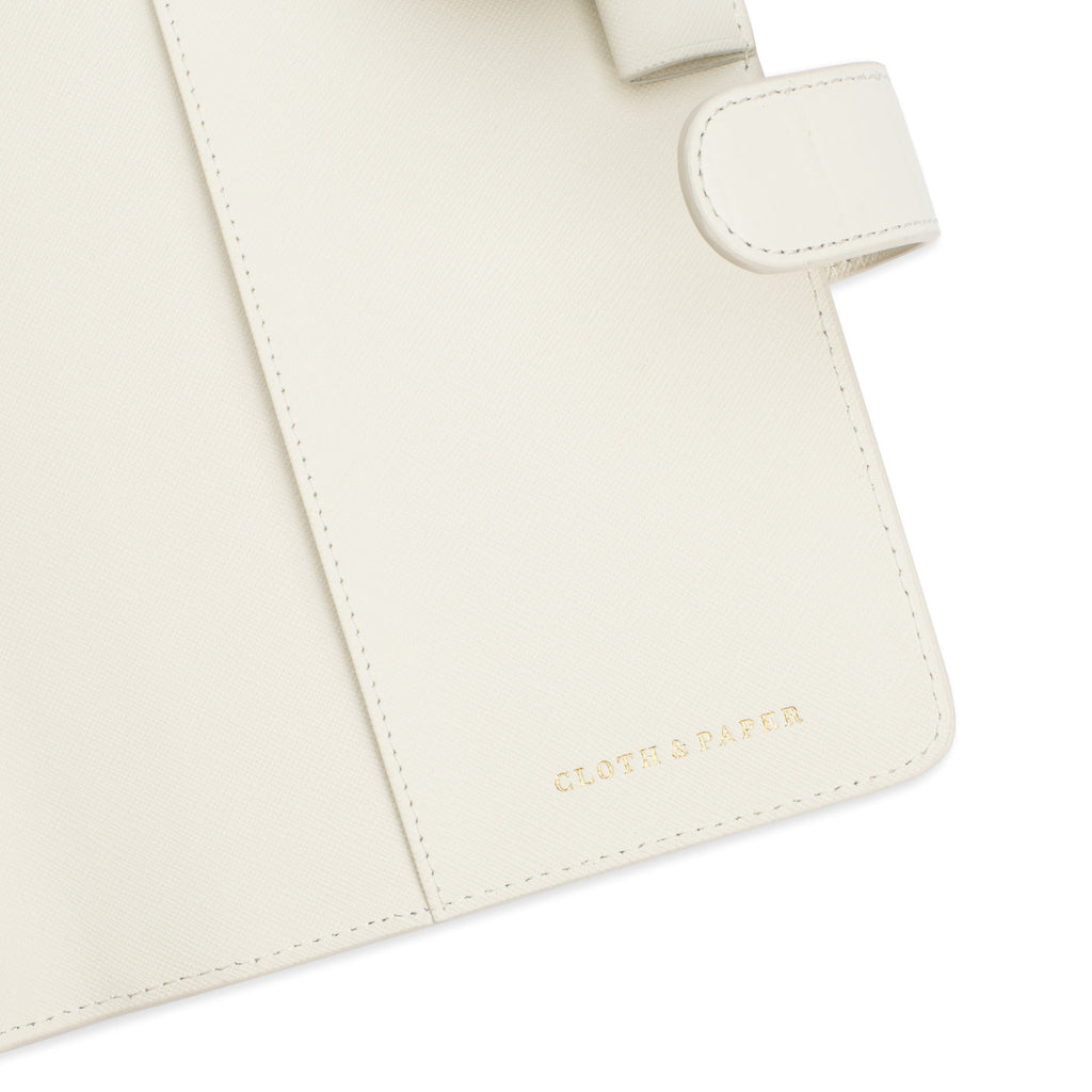 Close up of the Cloth and Paper embossed logo on the bottom interior of the planner.