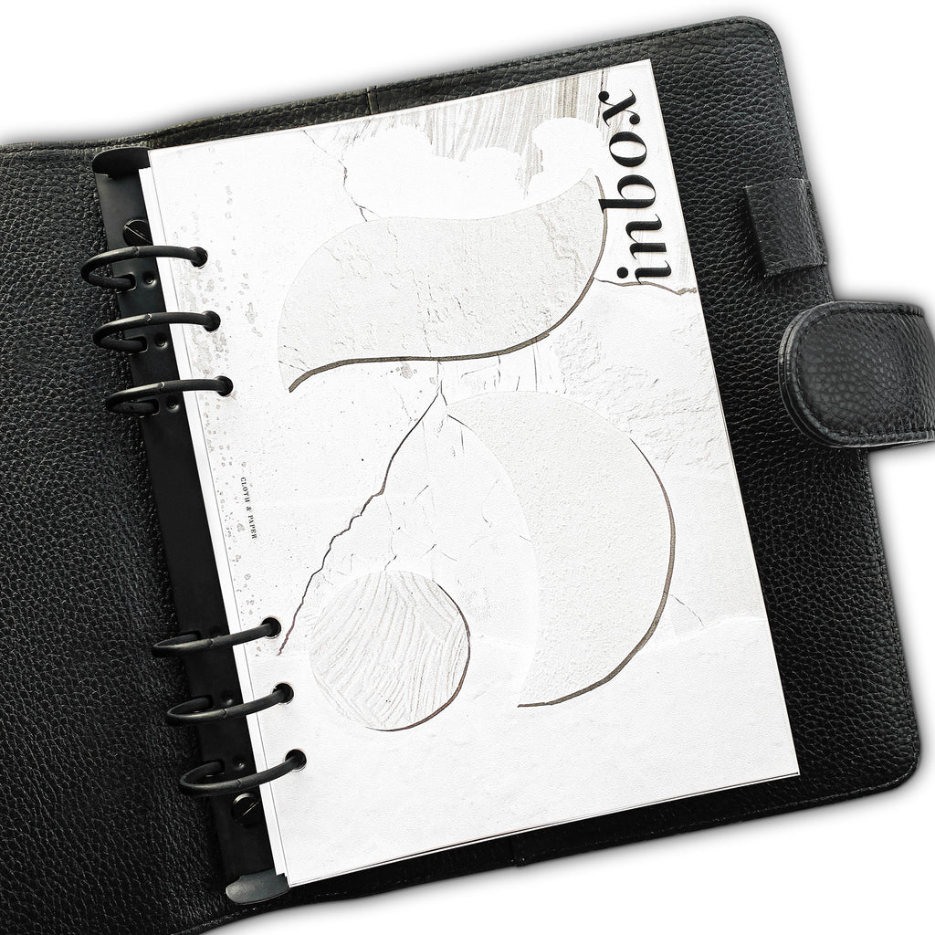 Dashboard in use inside a black leather planner.