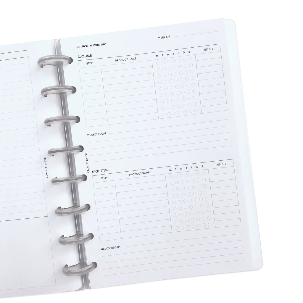 Inserts inside a discbound planner, with planner open to insert page.