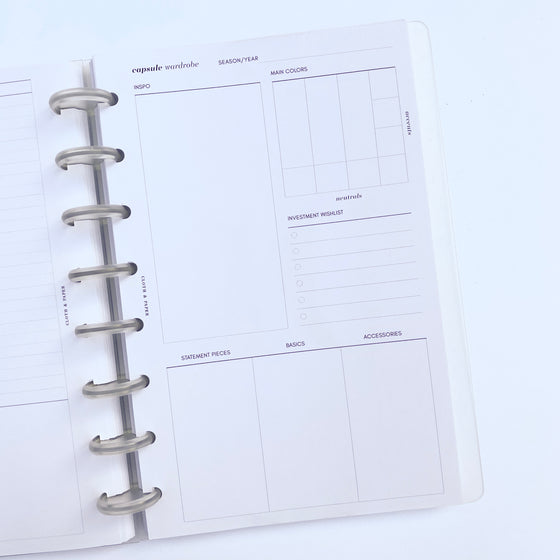 Capsule Wardrobe Inserts inside a discbound planner, with planner opened to insert page.