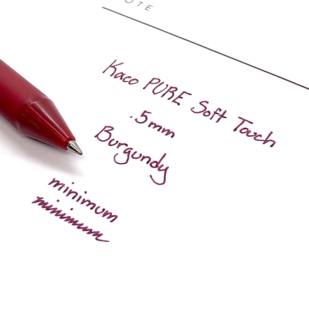 Kaco Pure Soft Touch Gel Pen, Burgundy, Cloth and Paper. Close up on pen nib and writing sample.