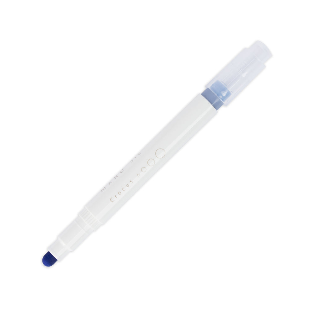 Crocus highlighter with tip exposed and cap posted to the end of its barrel on a white background.