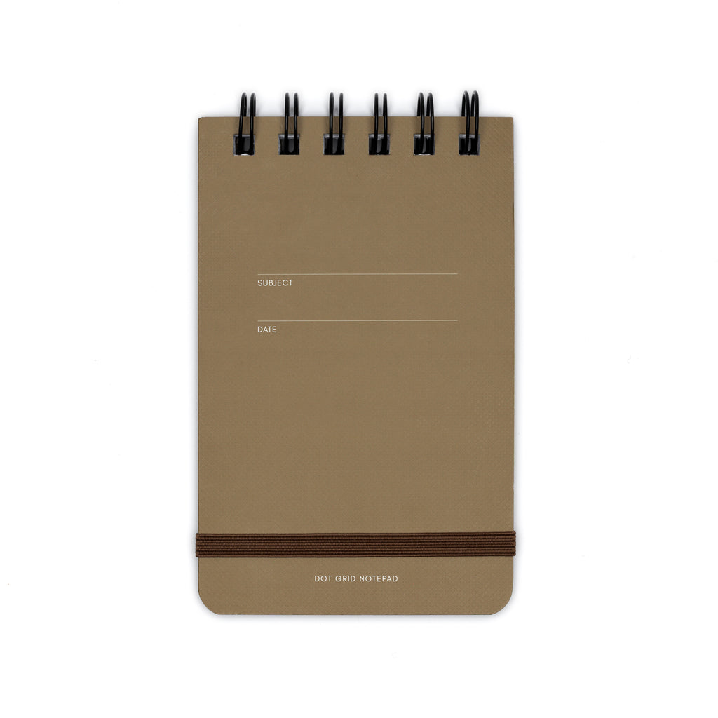 Dot grid notepad displayed on a white background. 