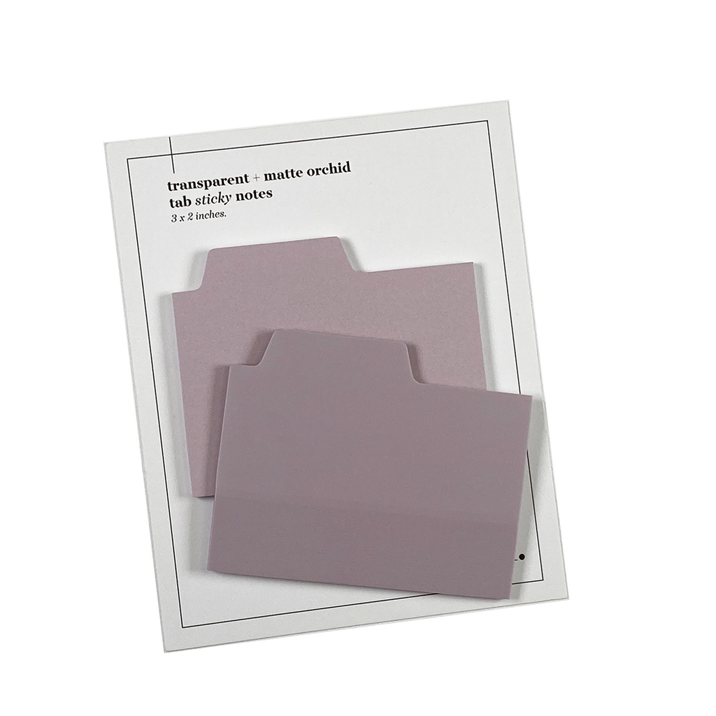 Blank Tab Sticky Note Set, Orchid, Cloth and Paper. Sticky note set displayed against a white background. The matte sticky note pad is attached to the sticky note backing, while the transparent sticky note pad is layered on top of it, turned slightly to the right.