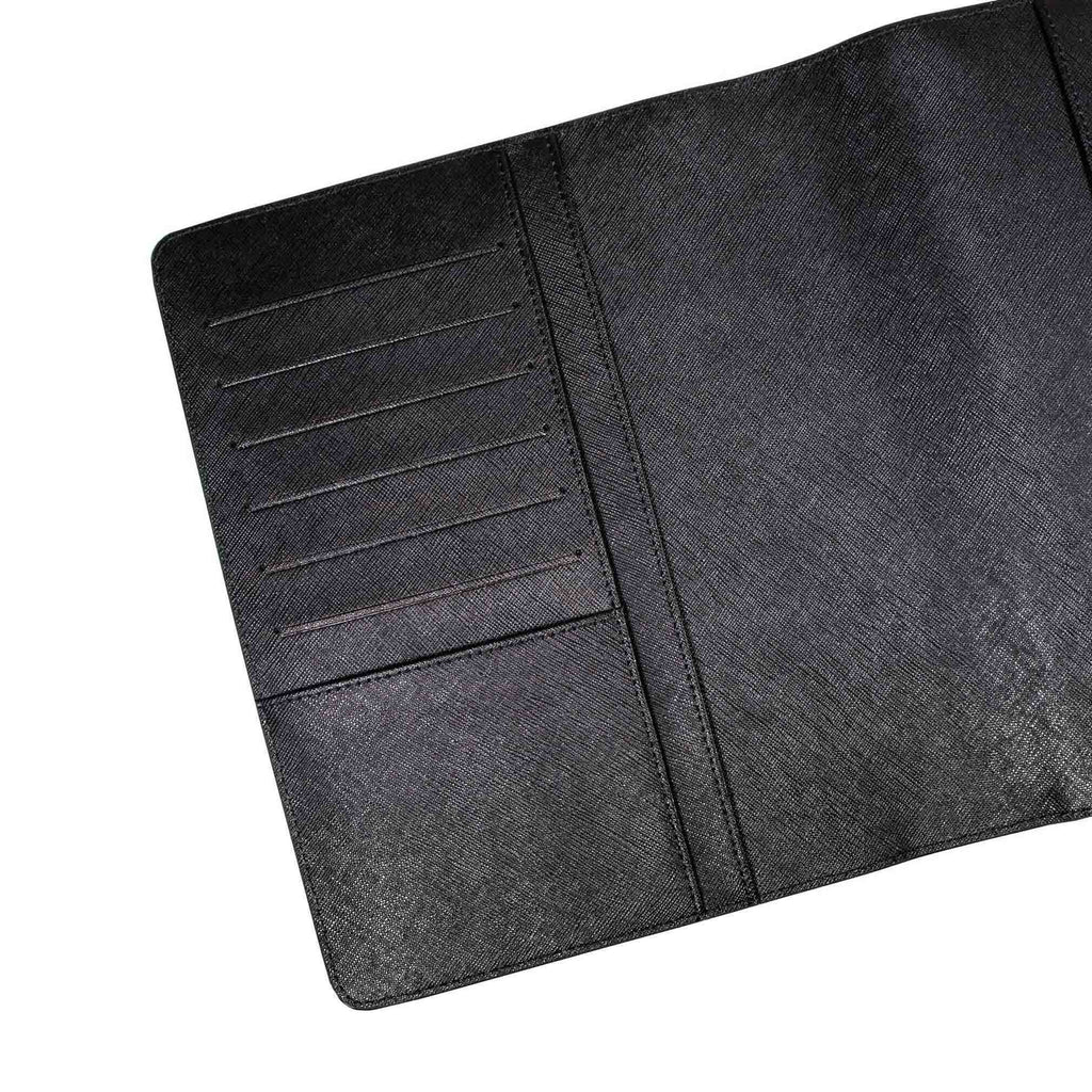 Close up on inside of front cover of black agenda cover. The document pockets, credit card slots, and passport pocket are shown.