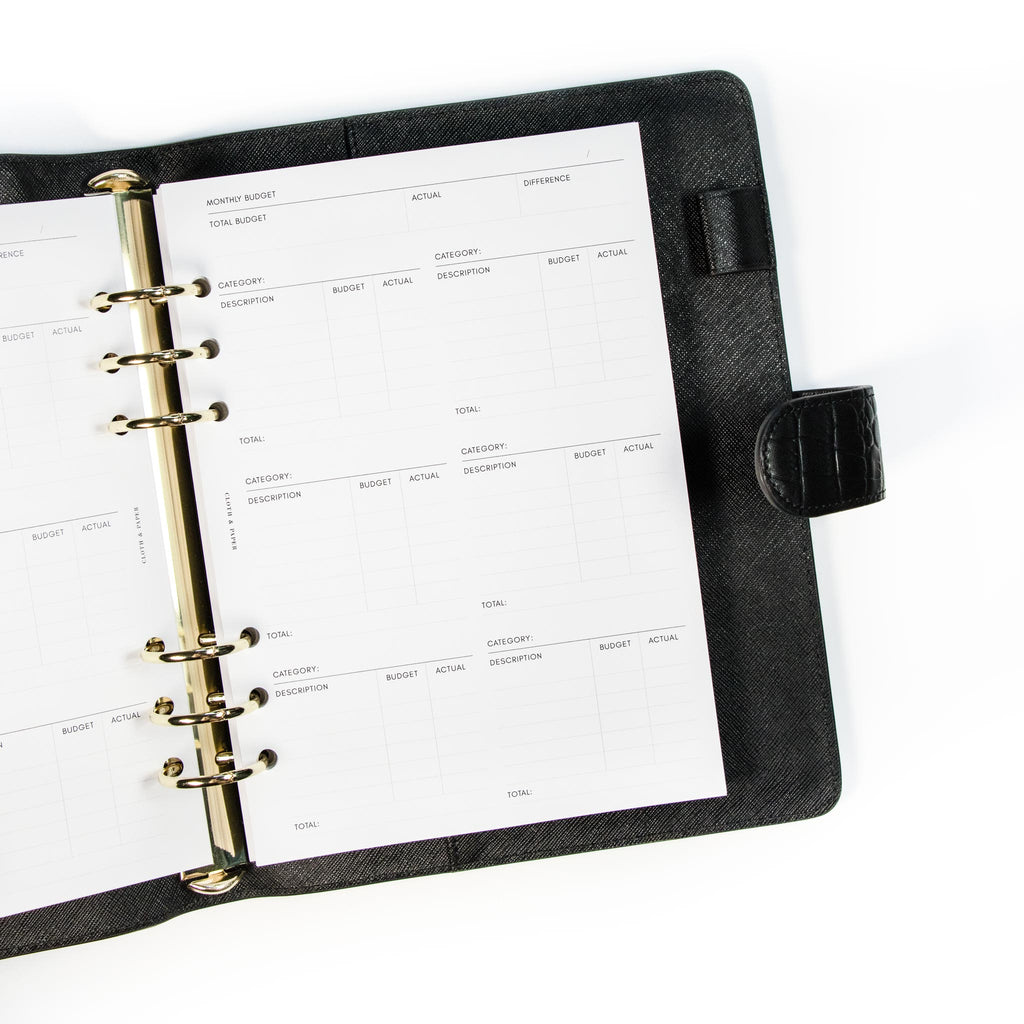 Insert bundle turned to Monthly Budget page inside a black leather agenda.