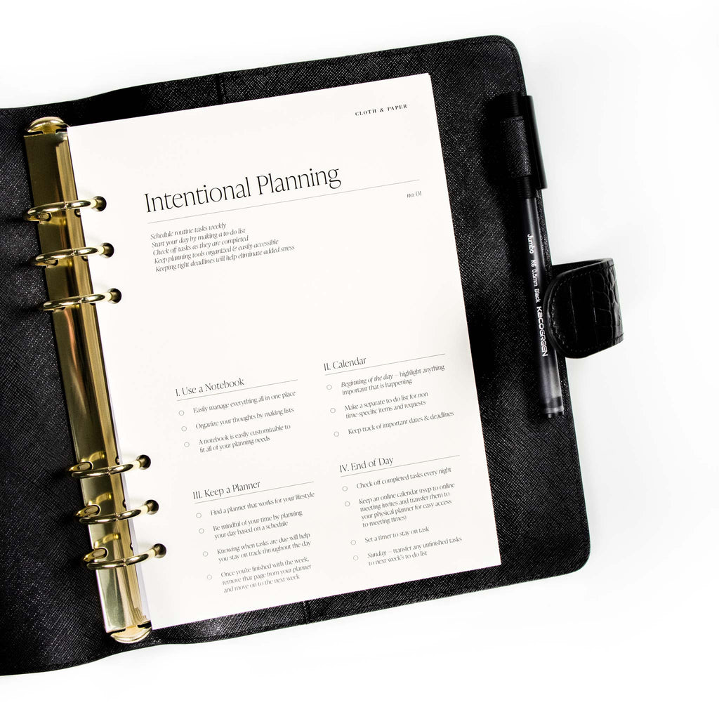 Intentional Planning Planner Dashboard displayed inside a black leather agenda.