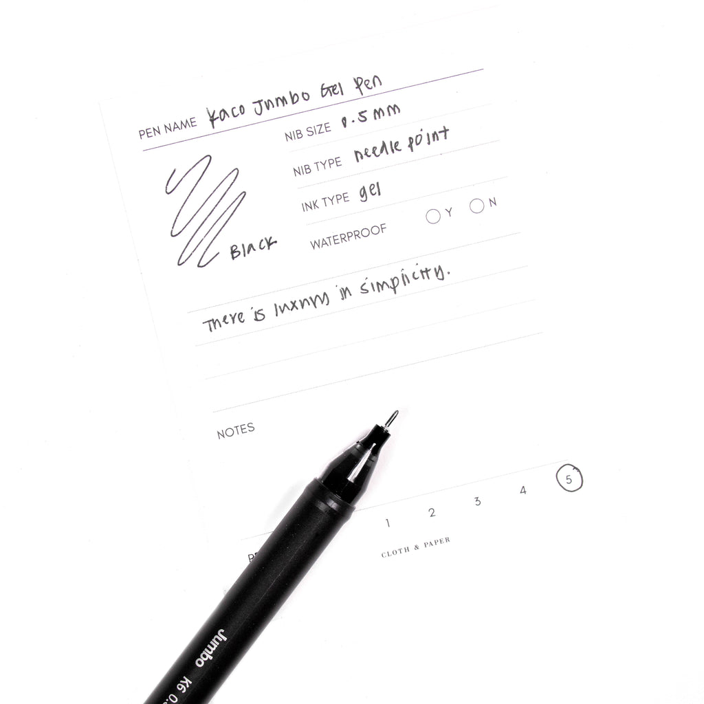 Kaco Jumbo Gel Pen, Cloth and Paper. Pen resting on pen test sheet displaying writing sample.