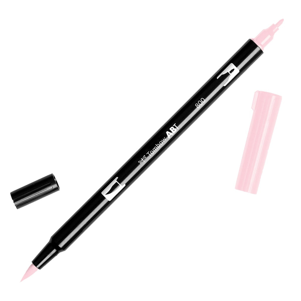 Tombow Dual Brush Art Marker, Pale Pink, Cloth & Paper. Art marker turned slightly to the right on a white background. It is uncapped on both ends showing the brush tip and fine tip.