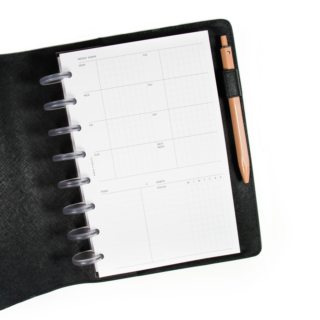Weekly Admin Planner Inserts styled inside a discbound planner. The planner is in a black leather cover with a pen tucked into the pen loop.